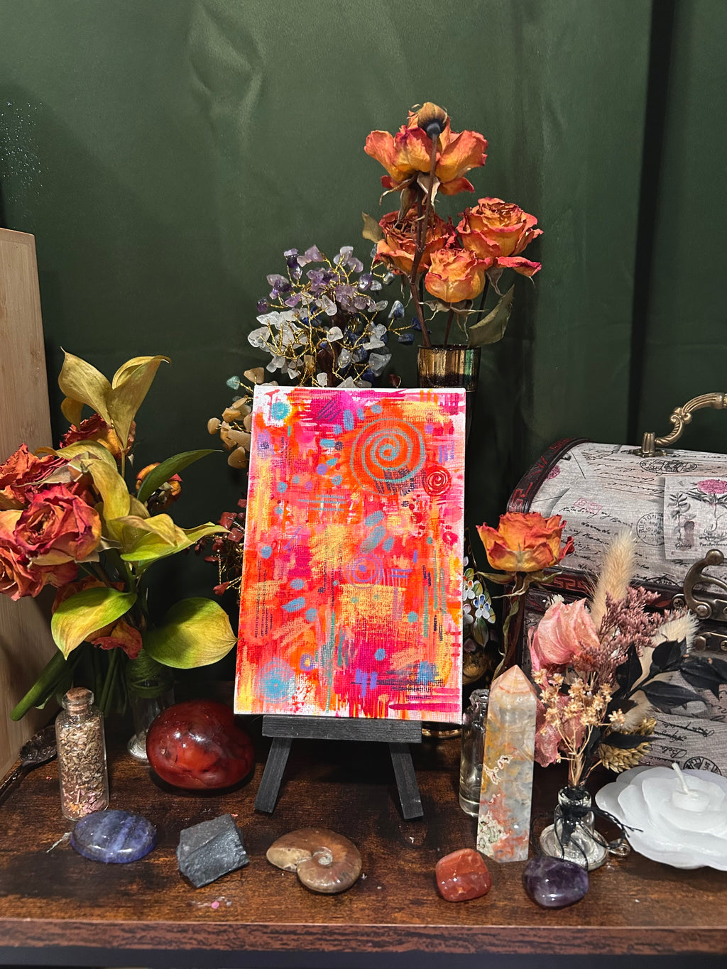 Full View of original abstract watercolor painting on a flat canvas called “Better Times” full of dotted patterns, geometric shapes and vibrant colors of pinks and yellows. on a textured canvas