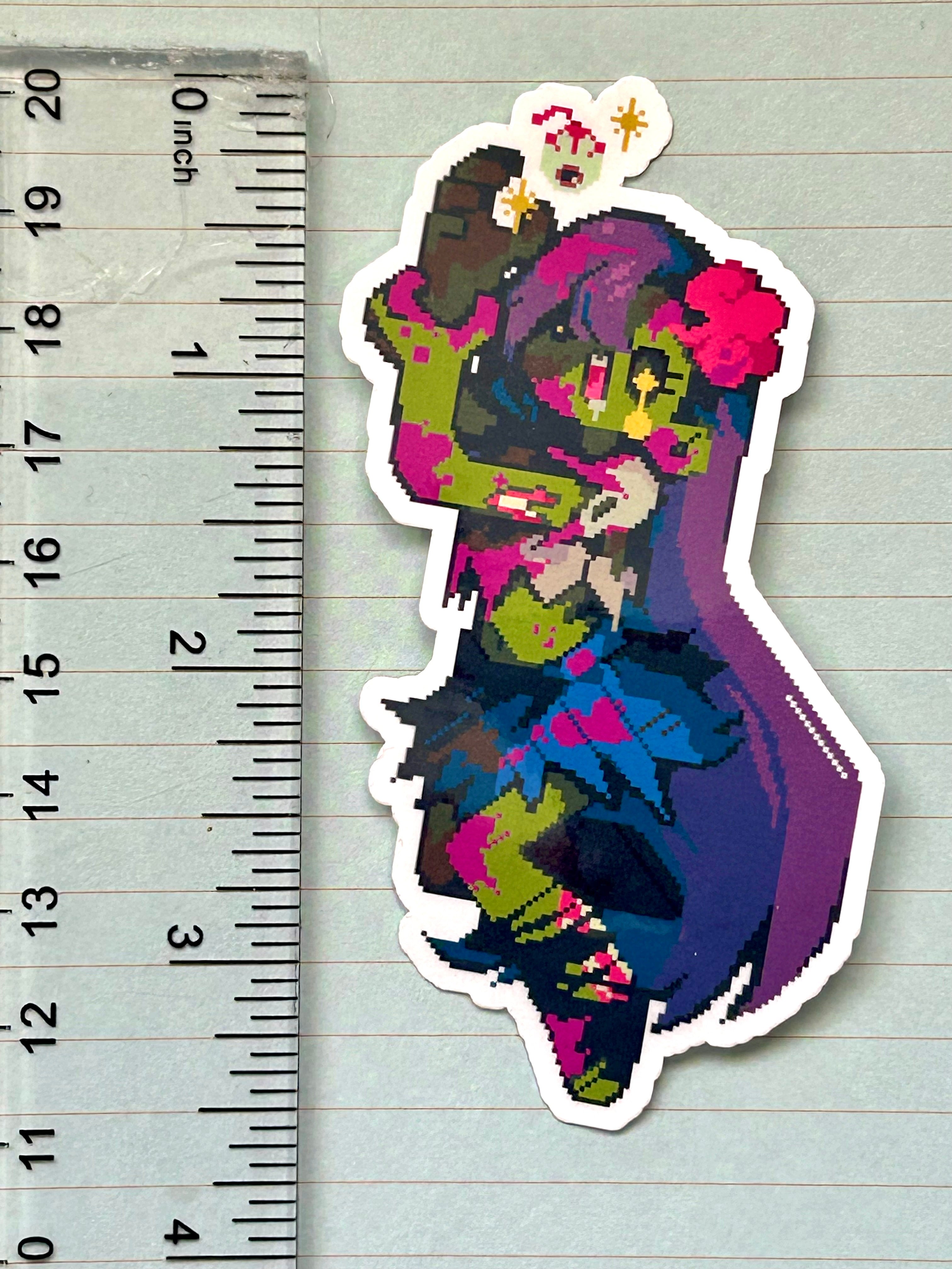 Sticker of a zombie girl drooling over an eyeball measuring 3.5" tall