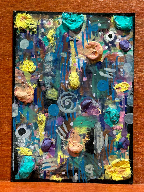 Full view of the original abstract mixed media painting titled Cartographer's Madness Part I featuring heavy 3D impasto paint dollops in teal, yellow, and peach over a dark blue background by Canvas of Sug