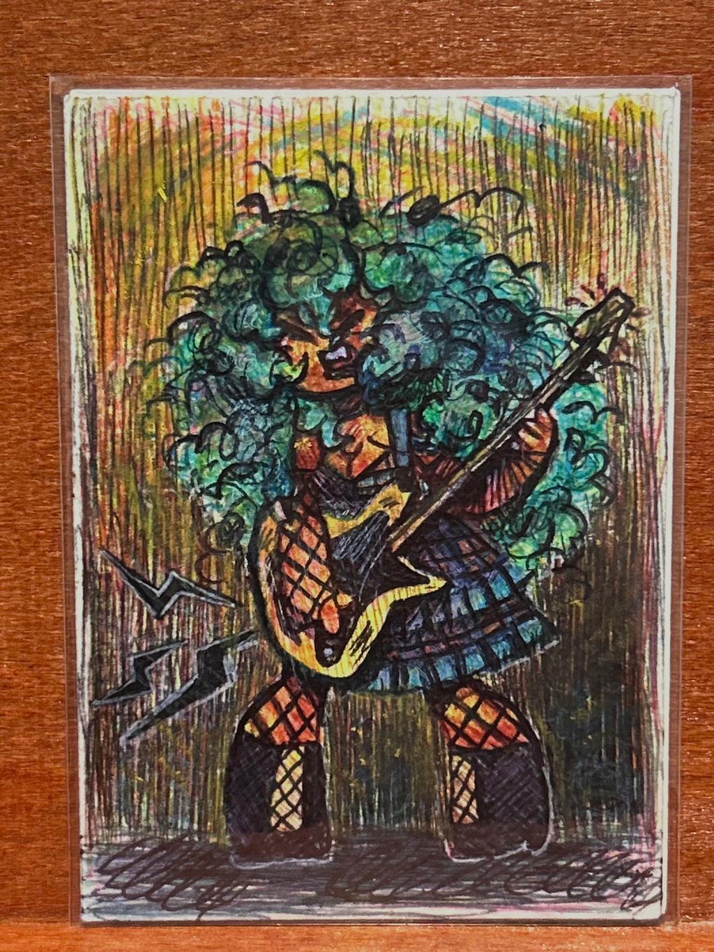 Full view of the original mixed media illustration titled Reactive featuring a stylized rockstar character with big teal curly hair playing a yellow electric guitar by Canvas of Sug.